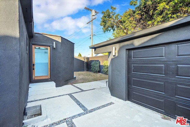 view of side of home with a patio area