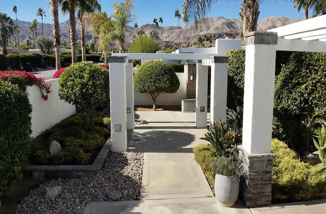 view of gate featuring a mountain view