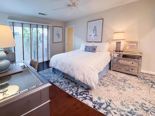 bedroom with ceiling fan and wood-type flooring