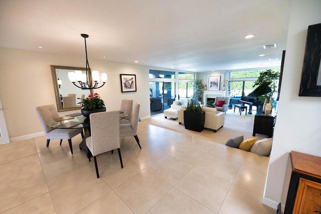 dining room featuring an inviting chandelier and light tile patterned flooring