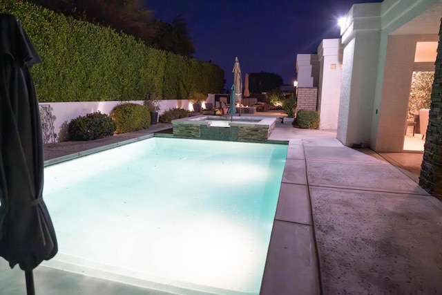 view of swimming pool with an in ground hot tub and a patio