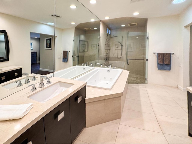 bathroom featuring separate shower and tub, vanity, and tile patterned flooring