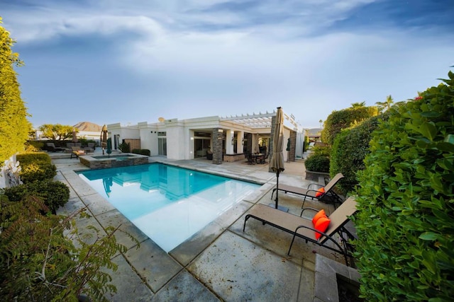 view of swimming pool featuring a pergola, a patio area, and an in ground hot tub