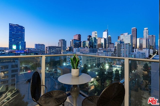 view of balcony at dusk