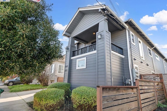 view of side of property with a balcony