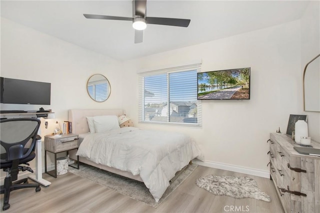 bedroom featuring light wood-type flooring and ceiling fan