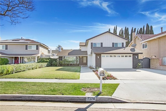 front of property with a garage and a front yard