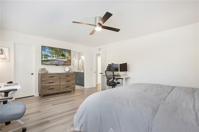 bedroom featuring ceiling fan, connected bathroom, and light hardwood / wood-style flooring