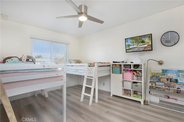 bedroom featuring ceiling fan and wood-type flooring