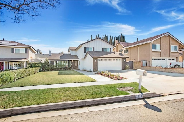 view of front of house with a garage and a front yard