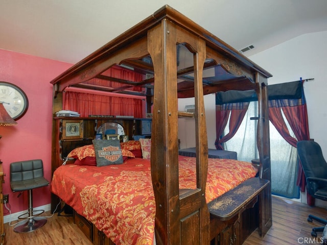 bedroom featuring wood-type flooring