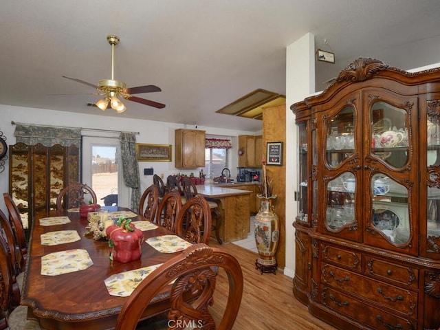 dining room featuring ceiling fan and light wood-type flooring