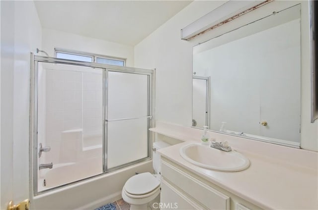 full bathroom with toilet, combined bath / shower with glass door, and vanity