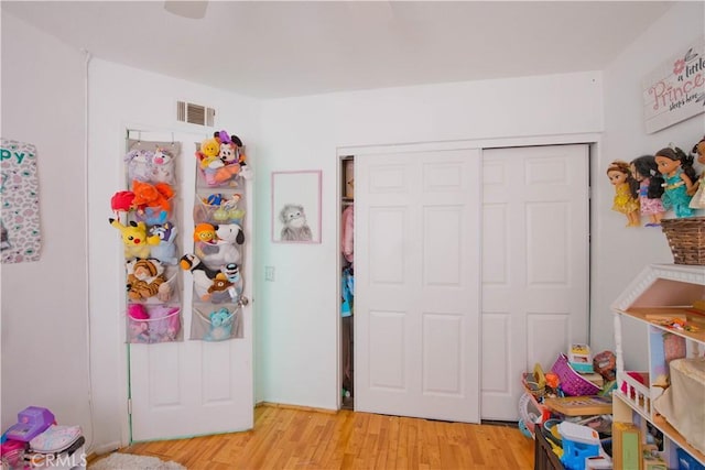 playroom featuring light wood-type flooring