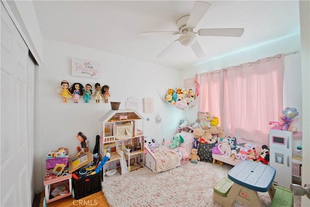 rec room with ceiling fan and hardwood / wood-style flooring