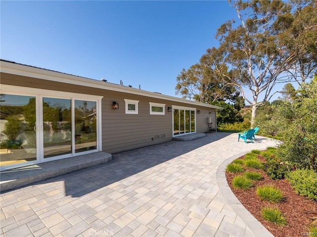 back of property featuring a patio area