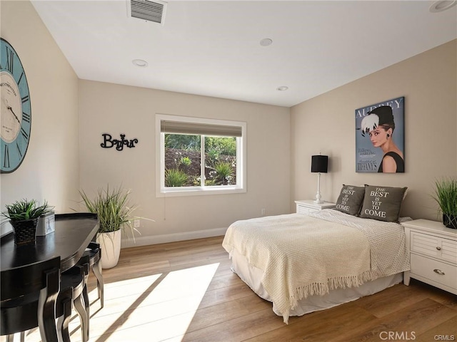 bedroom featuring light hardwood / wood-style floors