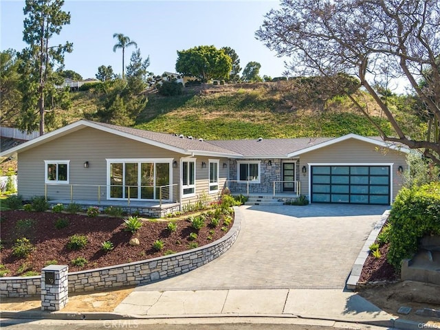 ranch-style home with a garage