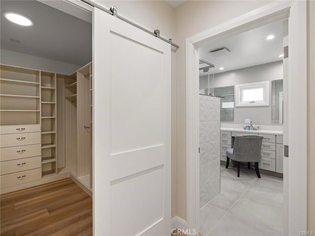 bathroom with walk in shower and vanity