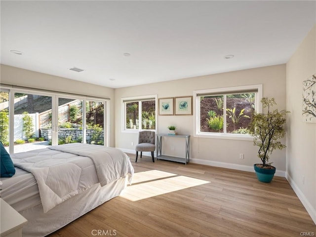 bedroom with light wood-type flooring