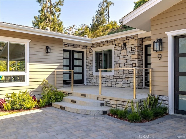 property entrance featuring a patio