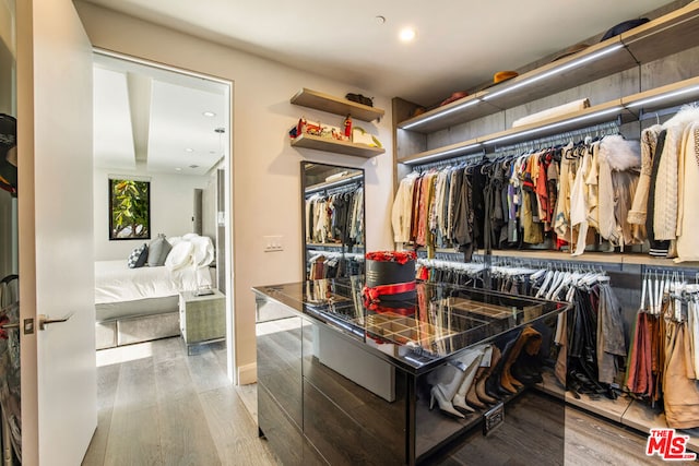 spacious closet featuring light wood-type flooring