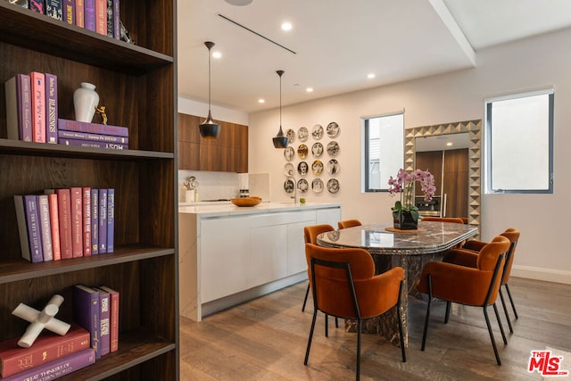 dining space with light hardwood / wood-style flooring