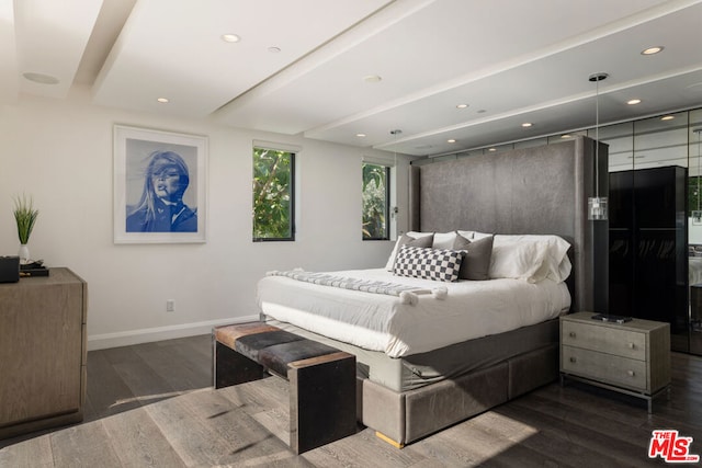 bedroom with dark wood-type flooring