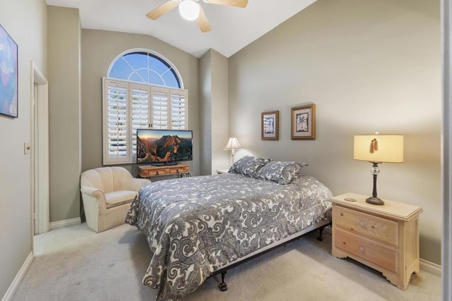 carpeted bedroom featuring vaulted ceiling and ceiling fan