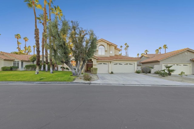 view of front of house featuring a garage and a front yard