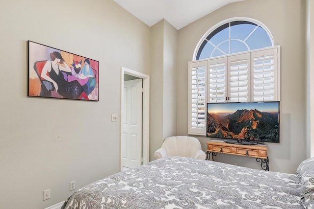 bedroom featuring vaulted ceiling