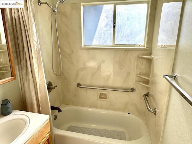 bathroom featuring vanity and shower / bath combination with curtain