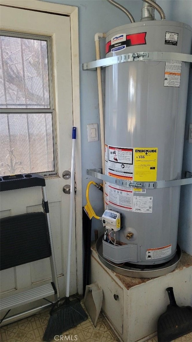 utility room with water heater