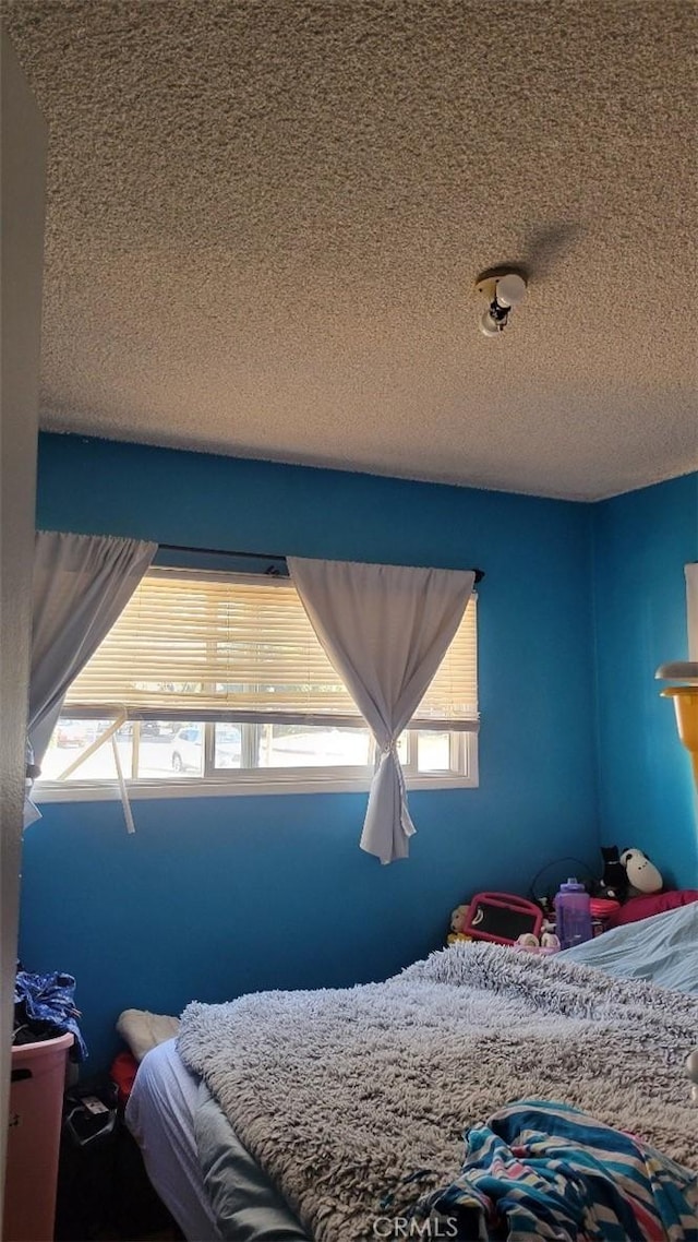 bedroom featuring a textured ceiling