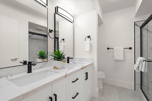 bathroom featuring vanity, an enclosed shower, and toilet