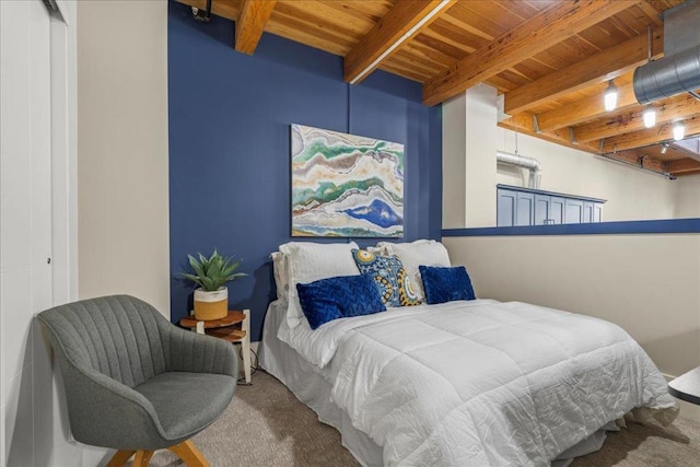 bedroom with wooden ceiling, a closet, beamed ceiling, and carpet flooring