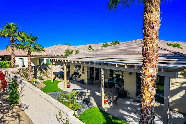 rear view of house with a patio