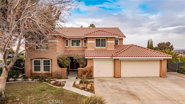 mediterranean / spanish-style home with a garage