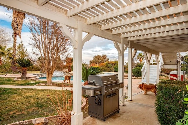 view of patio featuring a pergola and grilling area