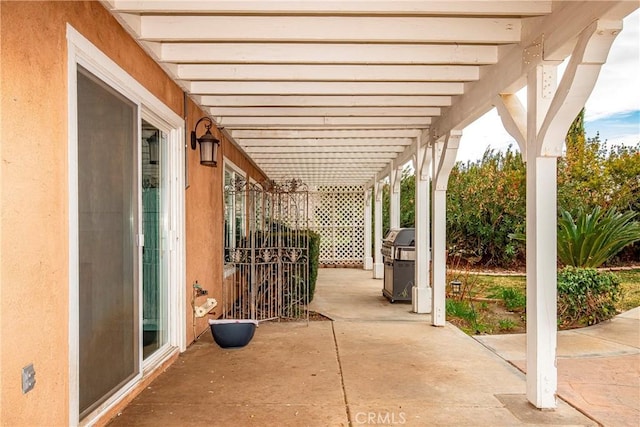 view of patio / terrace featuring a grill and a pergola