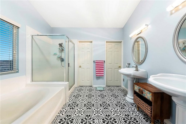 bathroom featuring double sink, tile patterned floors, and separate shower and tub