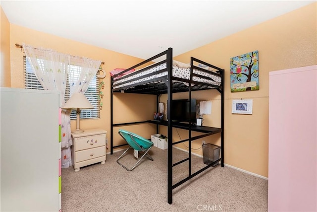 bedroom featuring light carpet