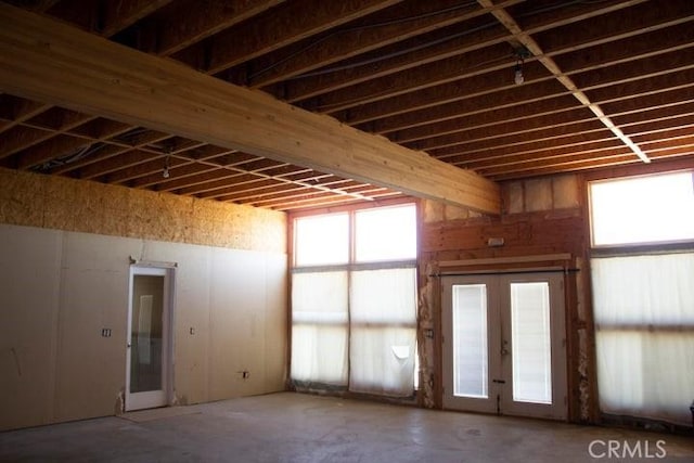 miscellaneous room featuring concrete floors and french doors