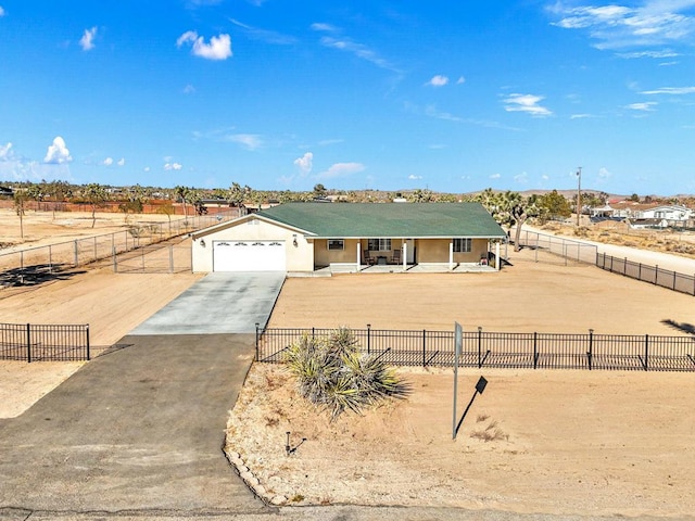 view of front of home featuring a garage and a porch