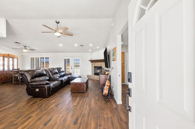 living room featuring ceiling fan, dark hardwood / wood-style flooring, and french doors