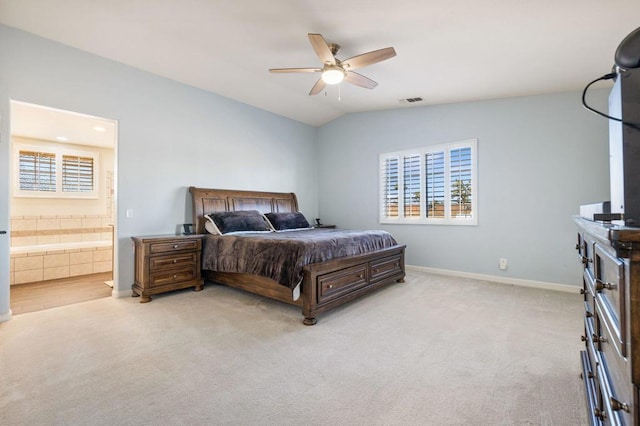 carpeted bedroom with lofted ceiling, ceiling fan, and connected bathroom