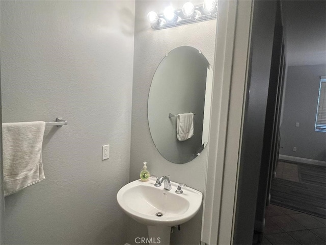 bathroom with tile patterned floors and sink