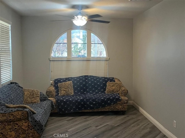 sitting room featuring ceiling fan and hardwood / wood-style floors