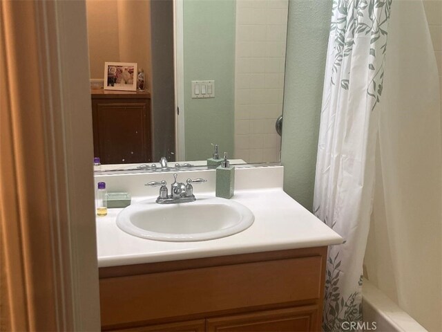 bathroom with vanity and shower / bath combo