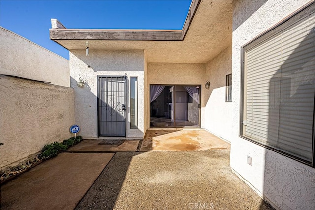 property entrance with a patio area